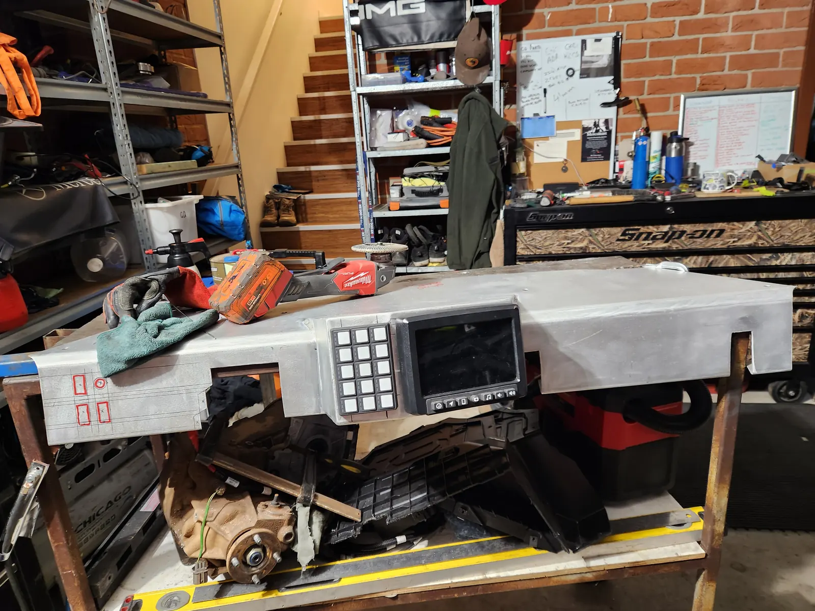Aluminium dash on the bench with a digital display and switch panel fitted