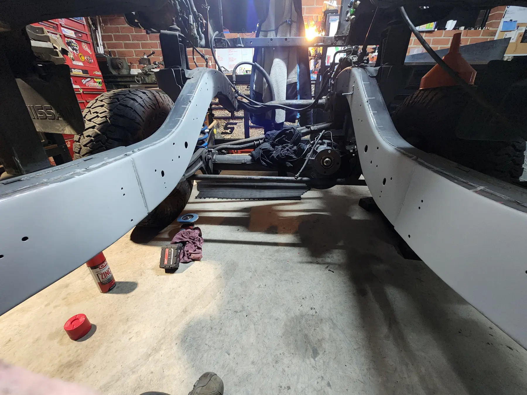 Both chassis rails painted grey, viewed from underneath the body