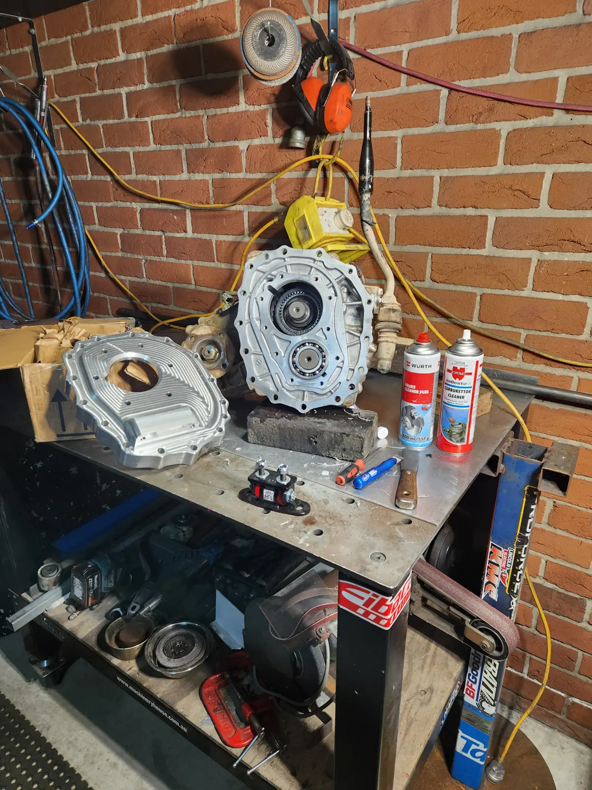 GU transfer case and an aluminium adapter plate on a welding table