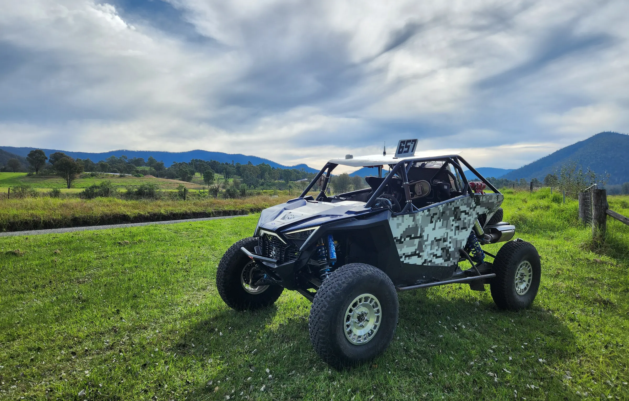 Race buggy built in the Speedtechau workshop, parked in a green valley